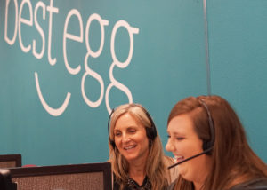 Best Egg employees on a phone call.