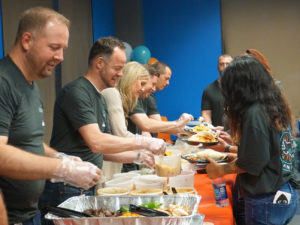 Best Egg employees serving lunch.