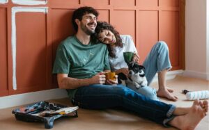 Couple working on their home renovation painting