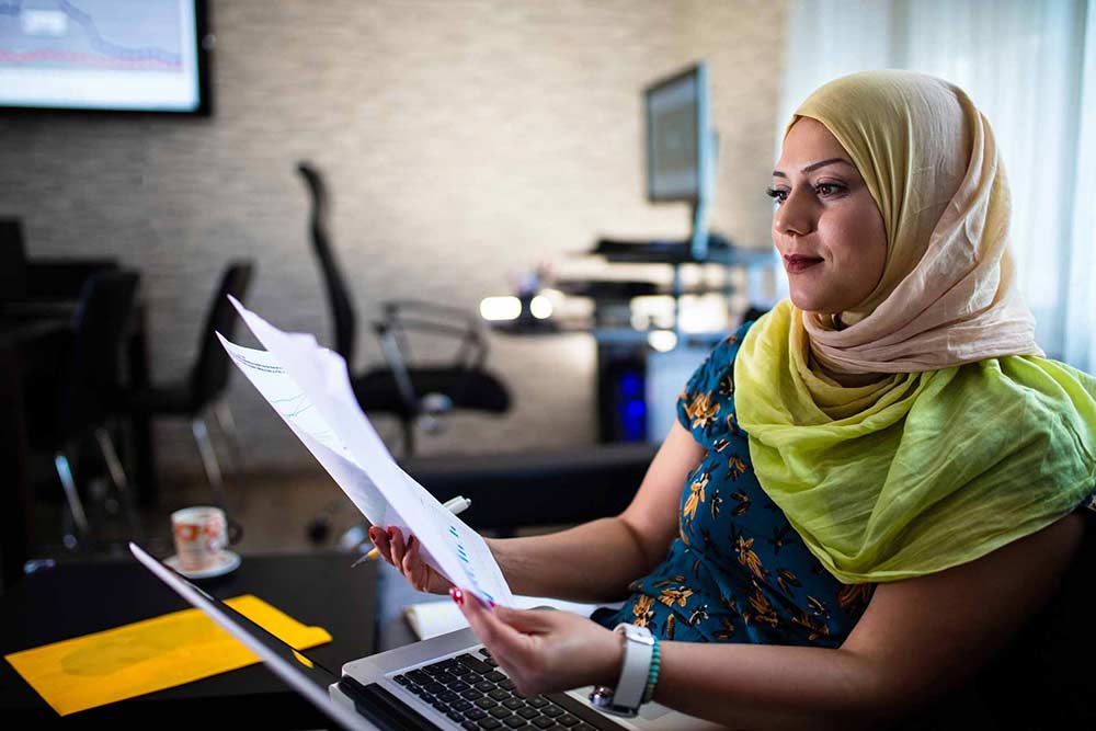 woman learning what a high yield savings account is.