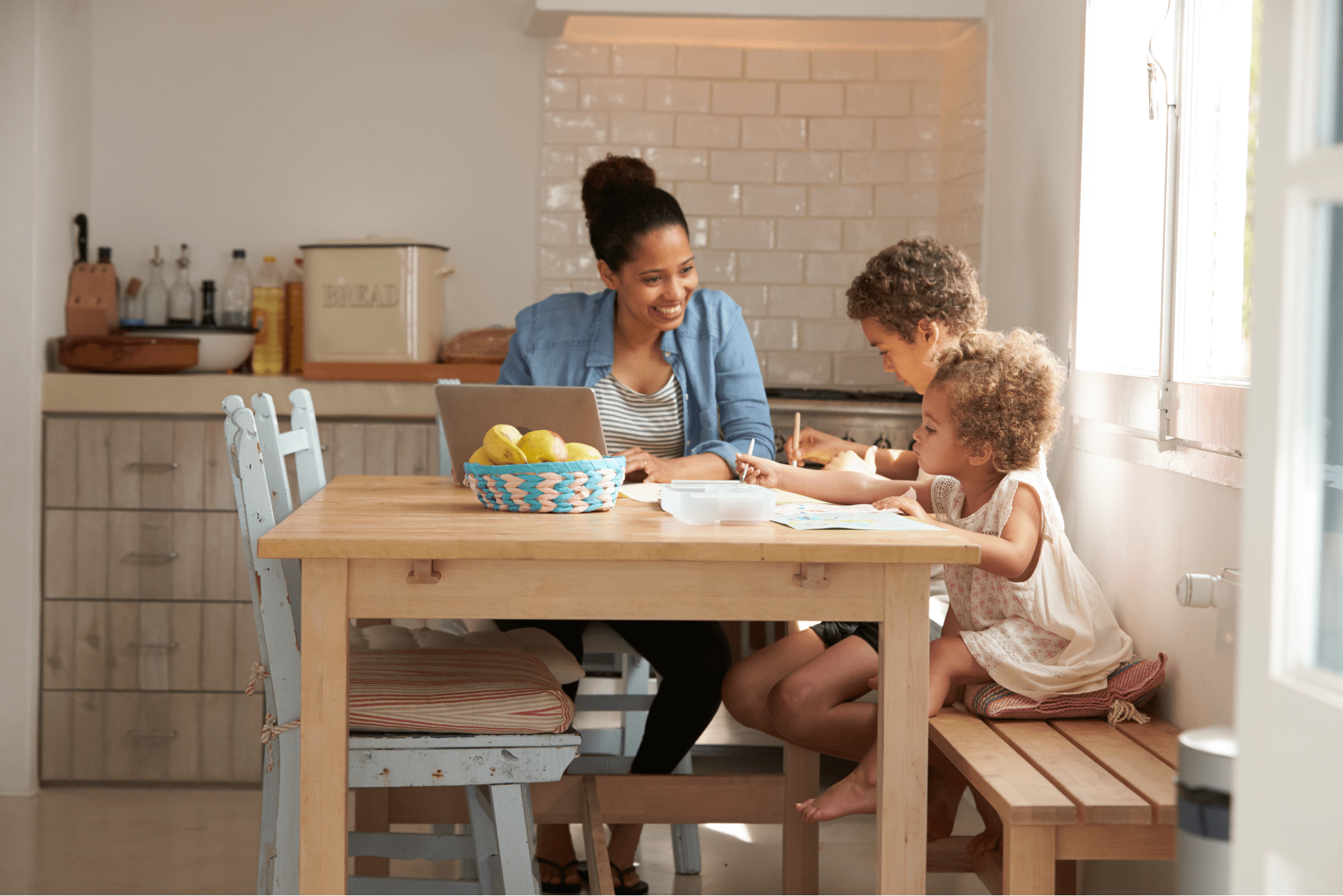 mom and kids learning how to create a monthly budget