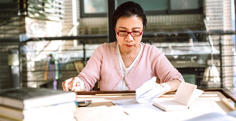 Woman calculating bills