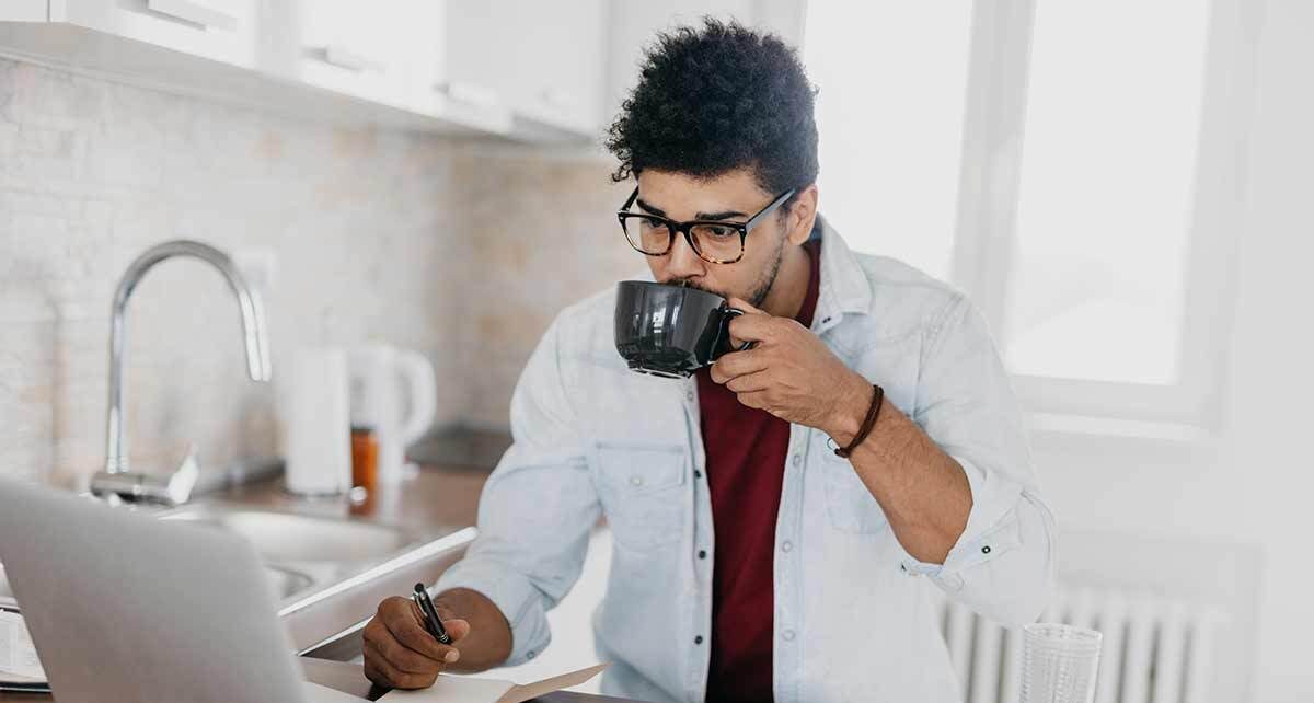 Man learning to reduce expenses on computer