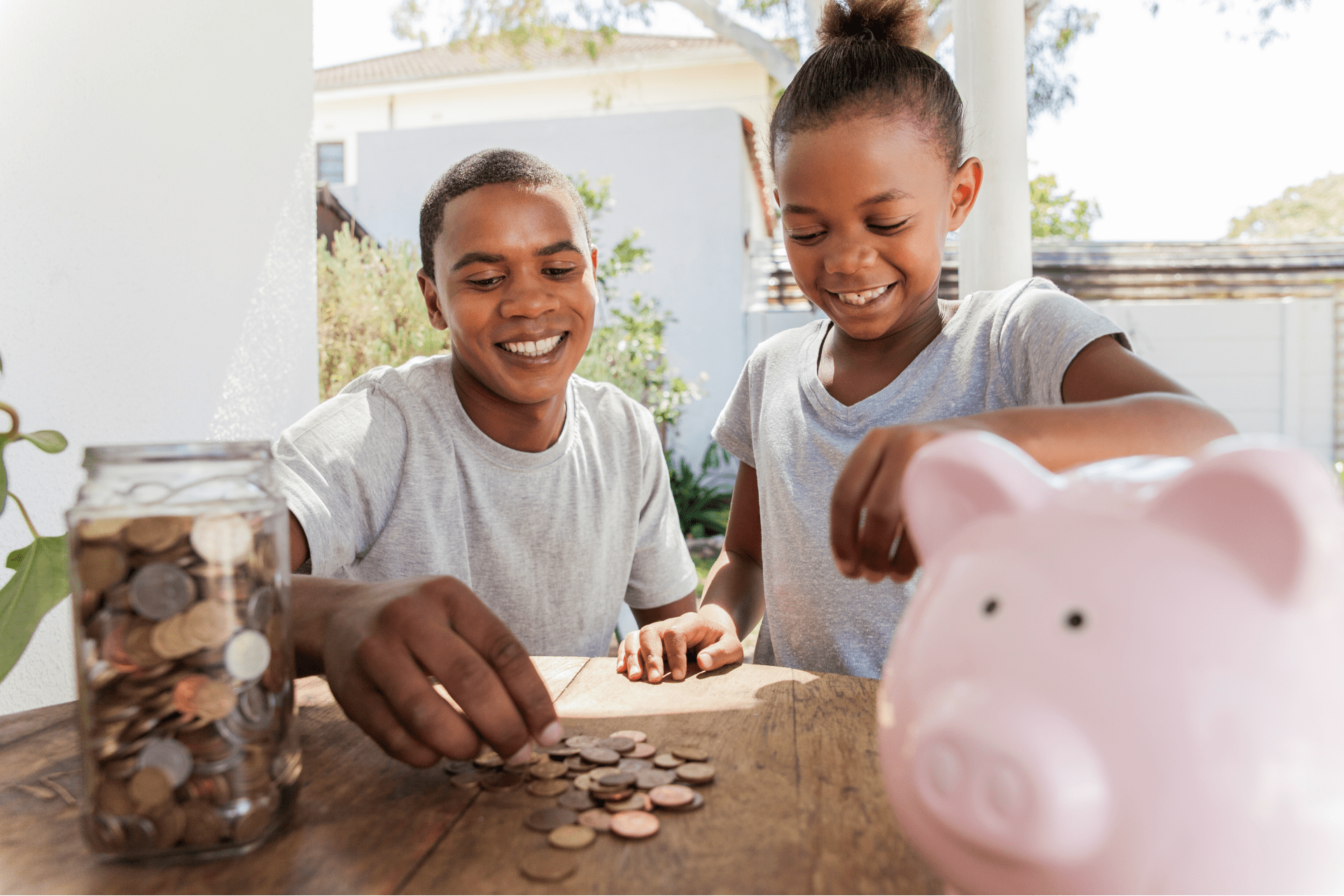 children playing with coins to learn about money