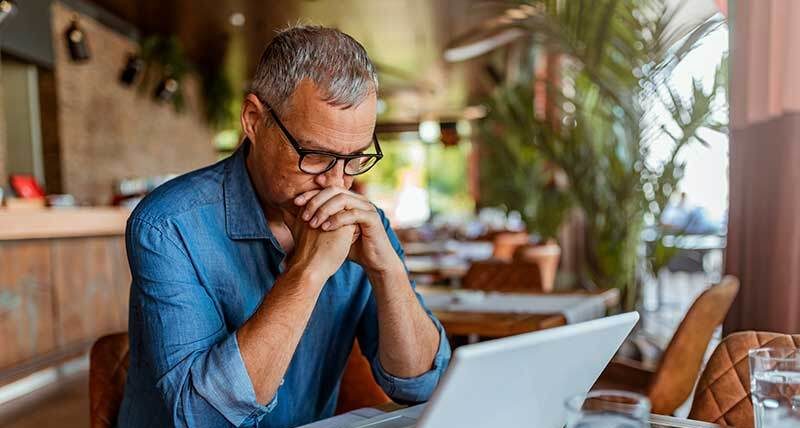 man looking at alternatives before considering filing for bankruptcy