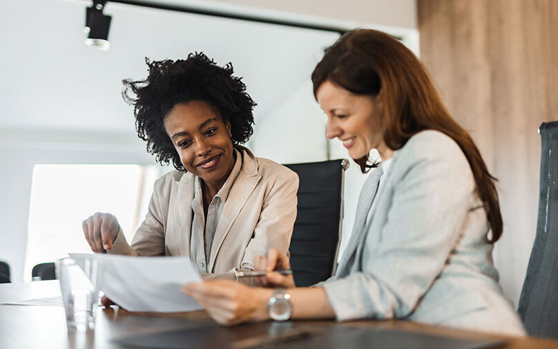 Women learning about in person vs online loans