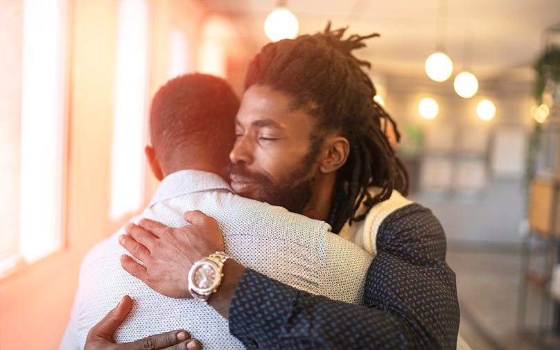 Two people hugging after disaster