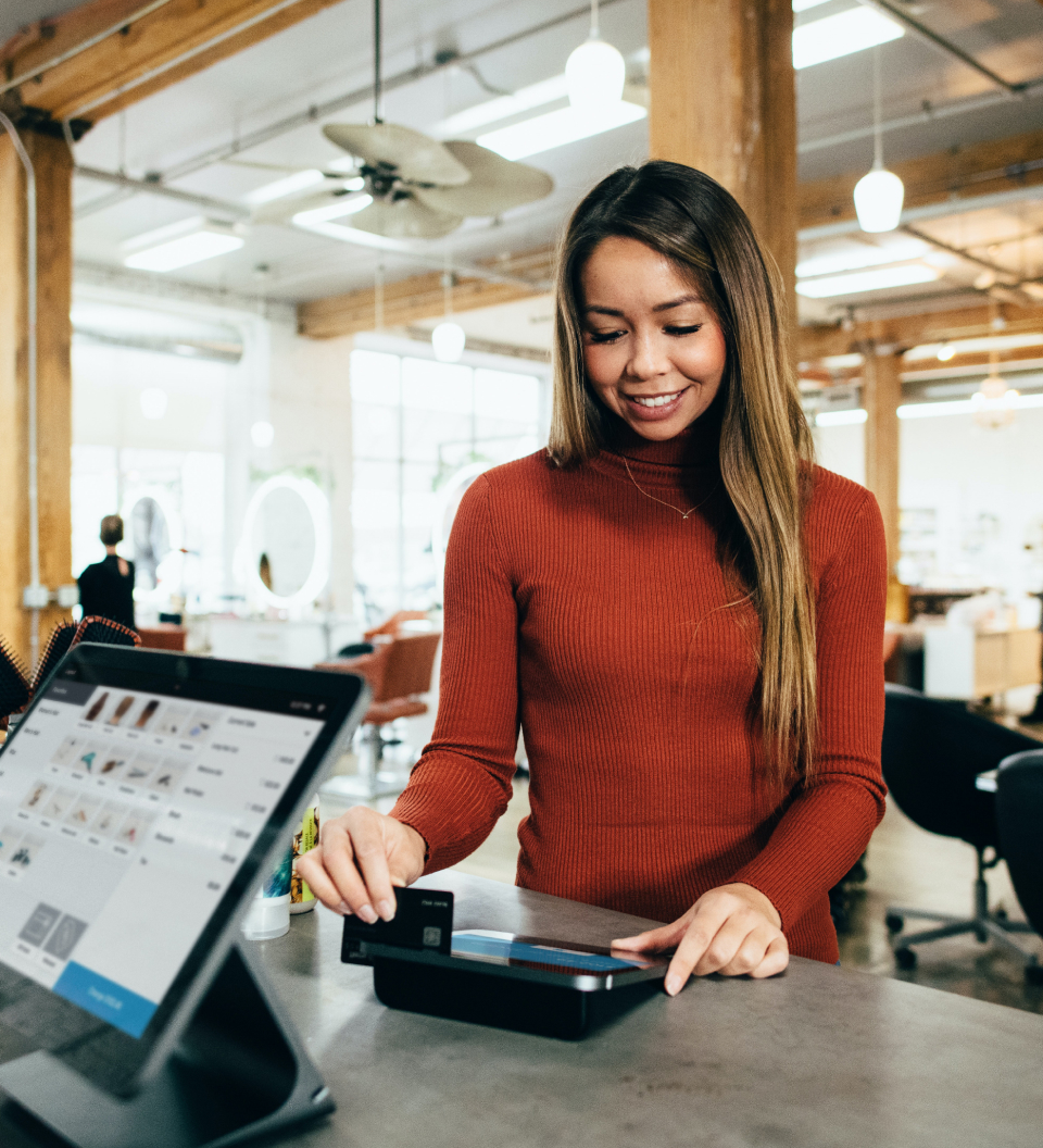 woman using her Best Egg credit card