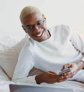 smiling person with phone