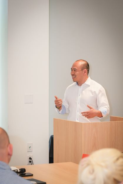 Man giving a lecture to his class