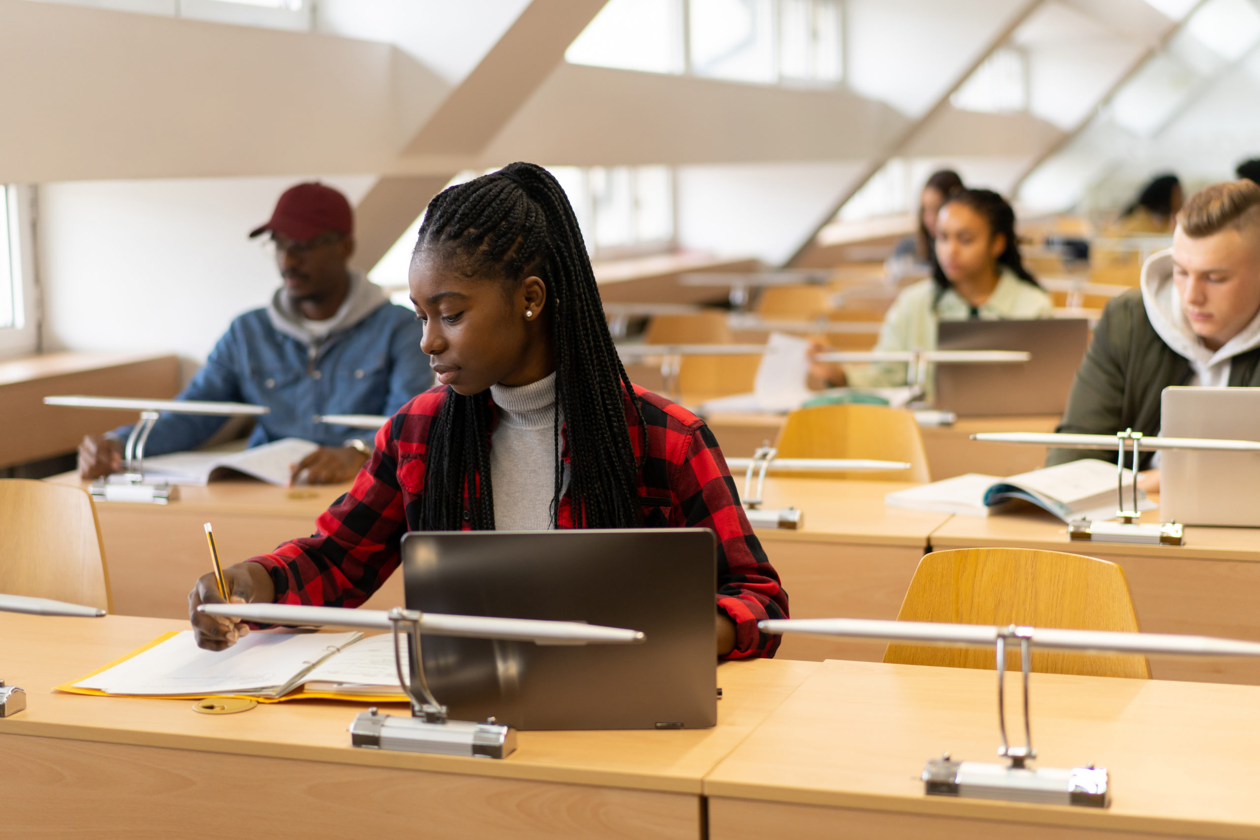 woman learning how to lower her student loan payments