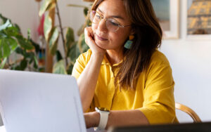 Woman looking at laptop