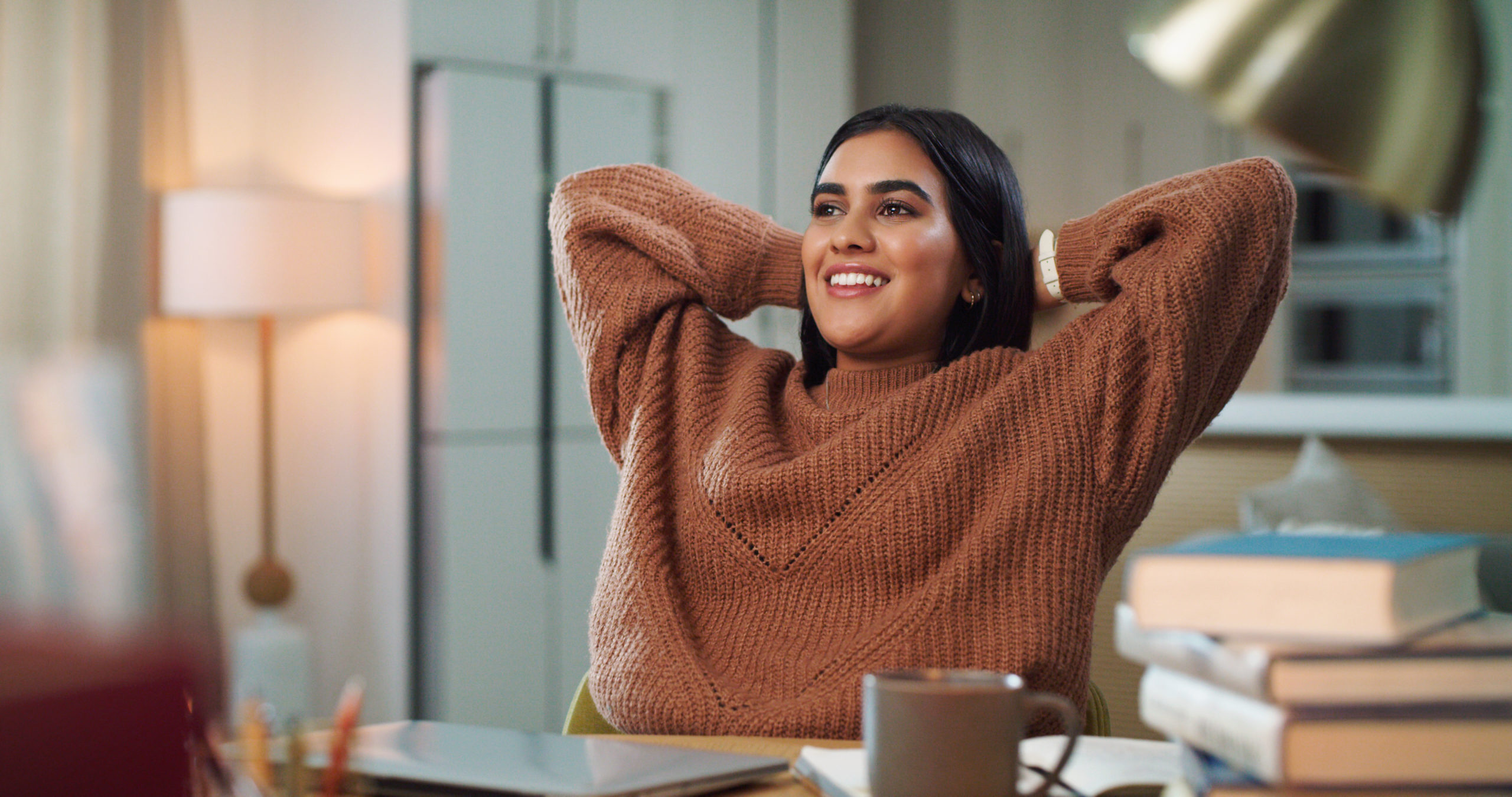 woman rejoicing after paying off her credit card