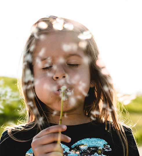 Child blowing bubbles