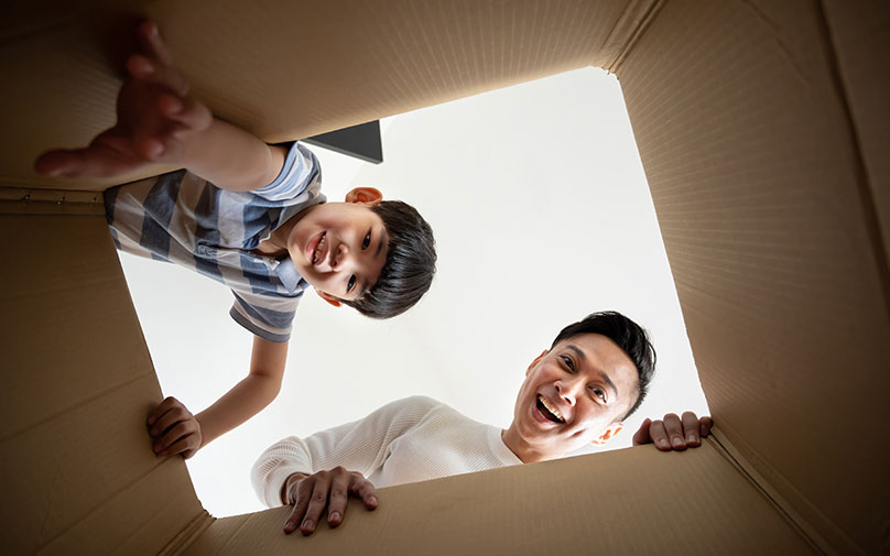 dad and son excited for cyber monday shopping