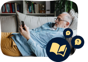 man laying on the couch on his phone