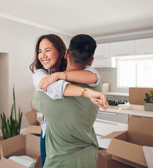 couple hugging while moving in