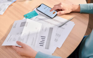 Person figuring out the difference between apr vs. interest rates