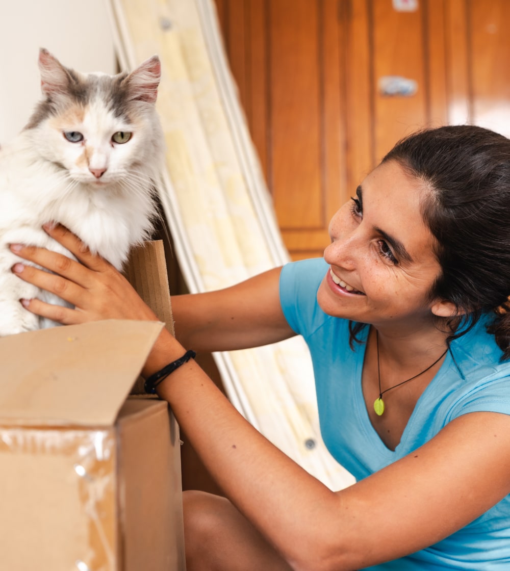 Woman smiling at her cat