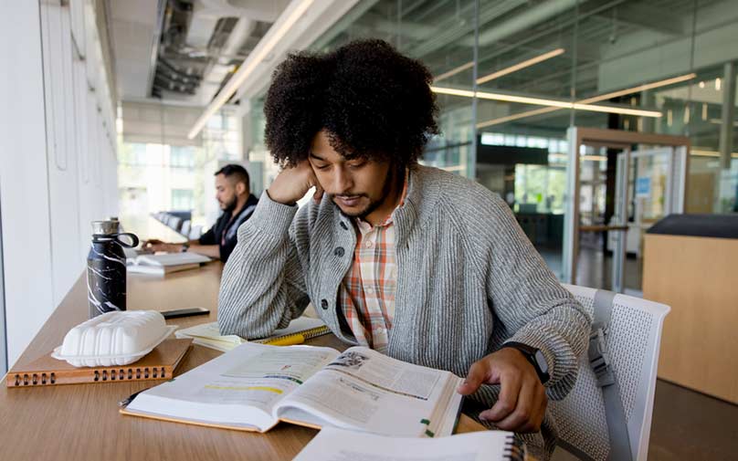 College student studying textbook