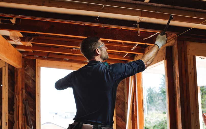 Man using tools to renovate home