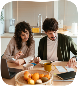 Couple reviewing receipts with fruit