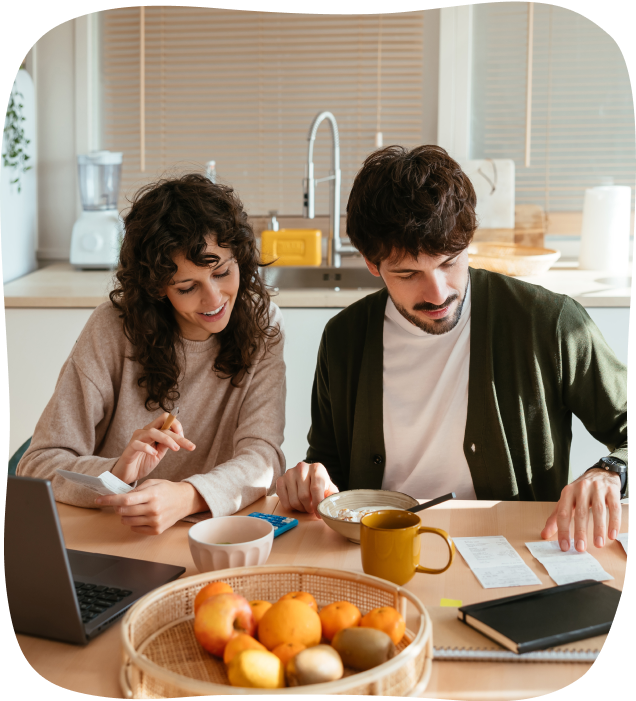 Couple reviewing receipts with fruit