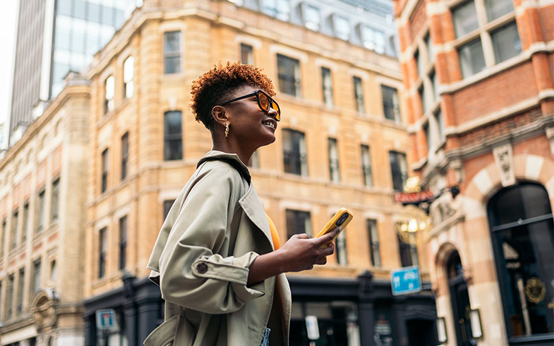 Woman in the city living breaking free from living paycheck to paycheck