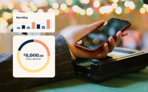 Person holding a phone to make a transaction via tap with Christmas lights and ambience in the background. Chart to show increasing pattern in spending value and a pie chart to highlight total amount spent.