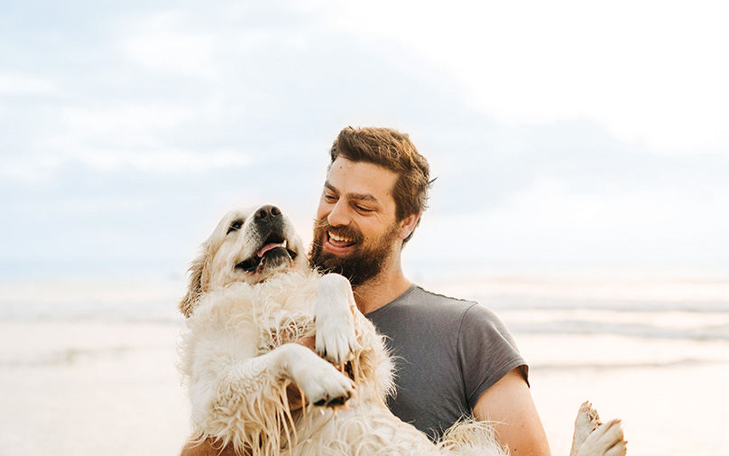 Man and dog at the beach