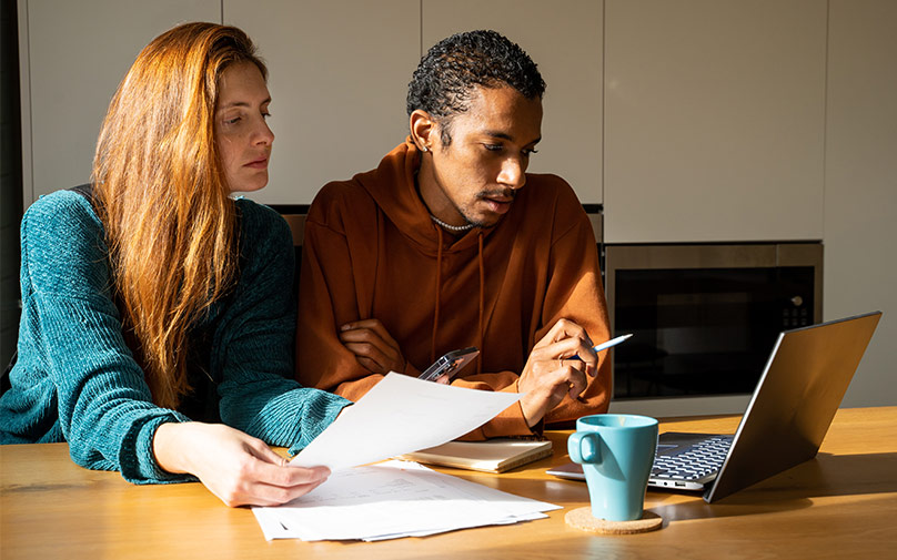 Woman and man working through paperwork