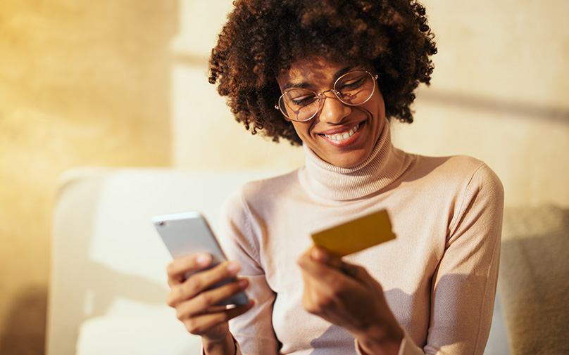 Woman looking for her CVV on her credit card