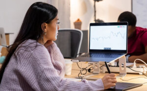 Woman tracking stocks to start an invest and reach financial goals
