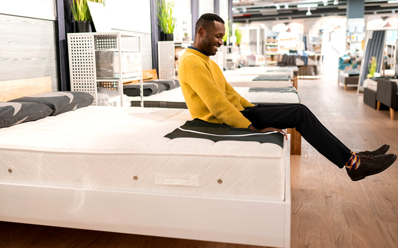 Man testing out mattress