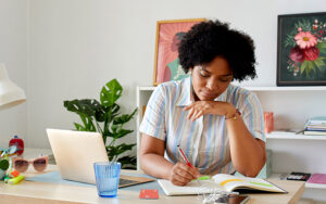 A woman comparing personal loans vs. credit cards