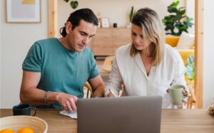 man and woman at laptop